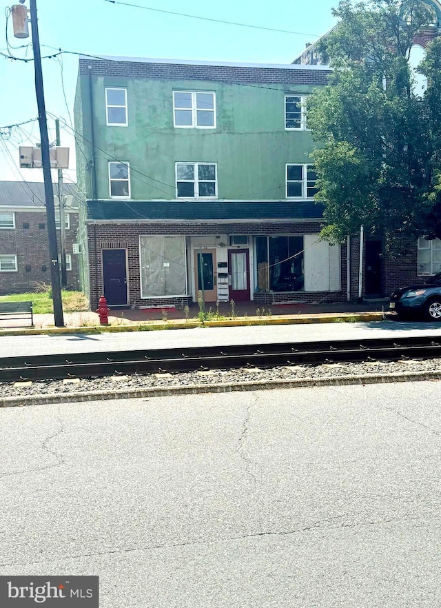 view of property with brick siding