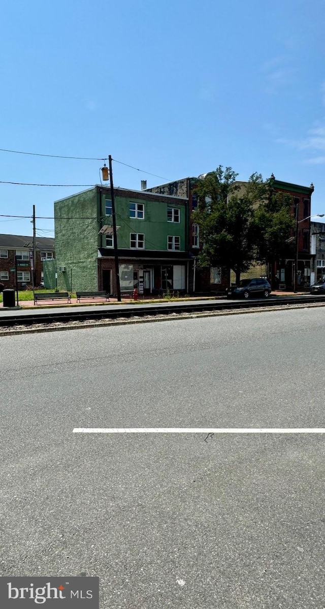 exterior space featuring curbs and sidewalks