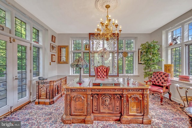 office space with french doors and an inviting chandelier