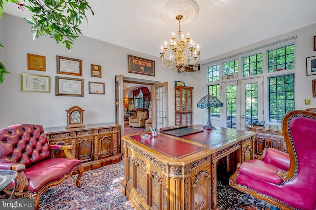 home office featuring french doors and a notable chandelier