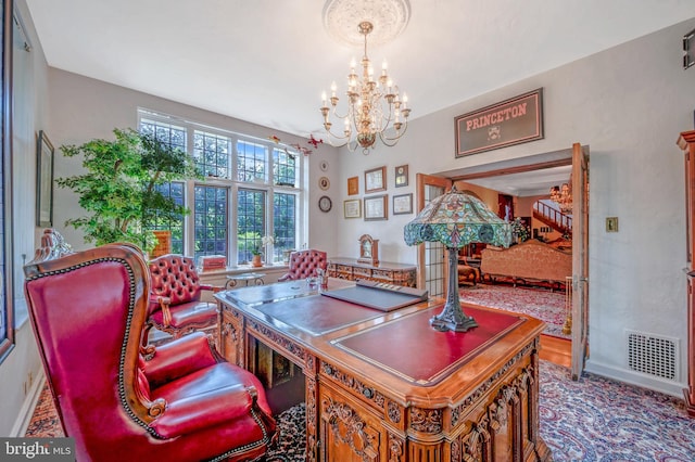 office featuring baseboards, visible vents, and an inviting chandelier