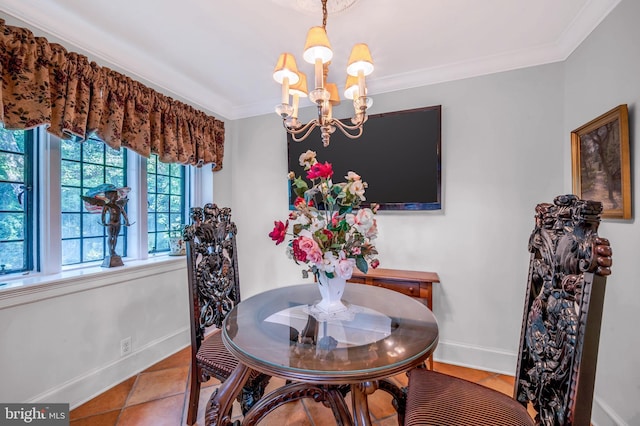 dining room with a chandelier, baseboards, tile patterned flooring, and crown molding