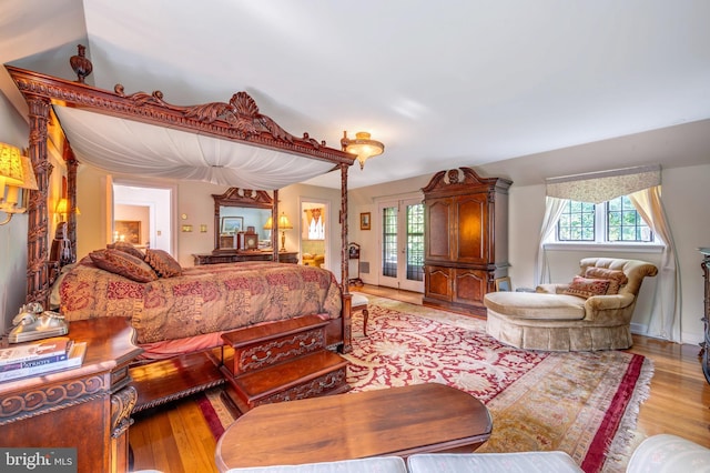 bedroom featuring light wood-style floors and multiple windows