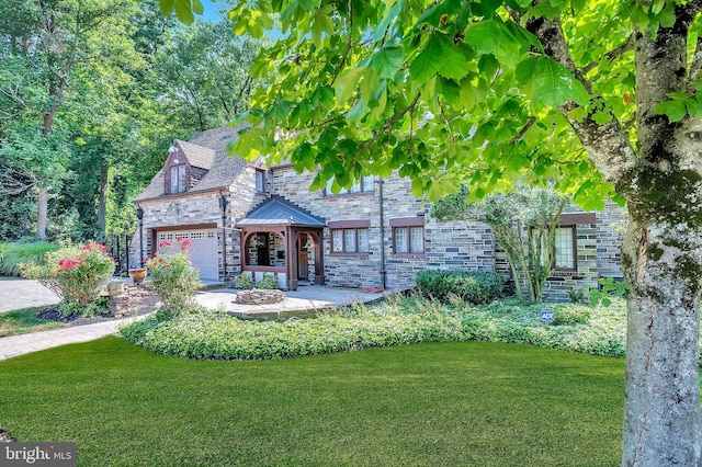 view of front of house with a standing seam roof, a garage, a high end roof, stone siding, and a front lawn