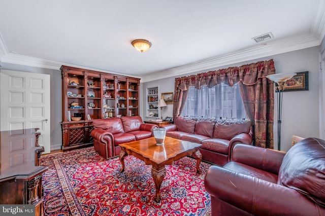 living room featuring ornamental molding, visible vents, and wood finished floors