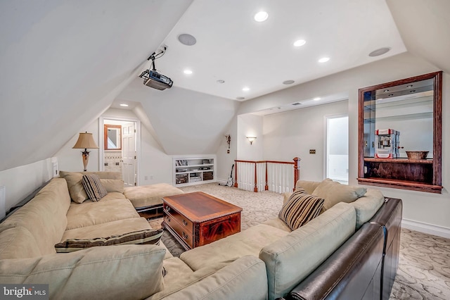 home theater with baseboards, vaulted ceiling, and recessed lighting