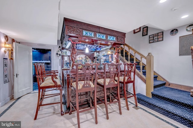 bar featuring recessed lighting, stairway, and a dry bar