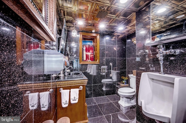 bathroom featuring toilet, granite finish floor, vanity, tile walls, and an ornate ceiling