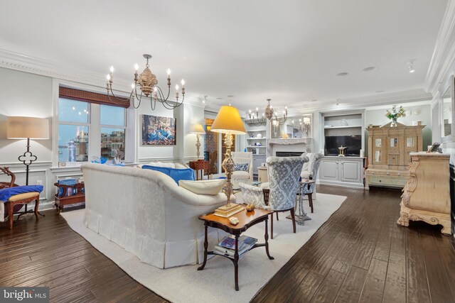 living room featuring ornamental molding, dark wood-type flooring, built in features, and a chandelier