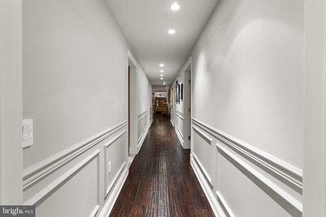 corridor featuring dark hardwood / wood-style floors