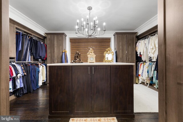 spacious closet featuring dark wood-type flooring and a notable chandelier