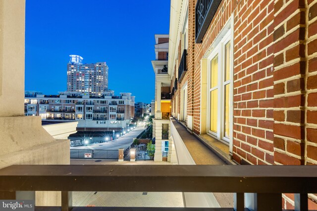 view of balcony at twilight