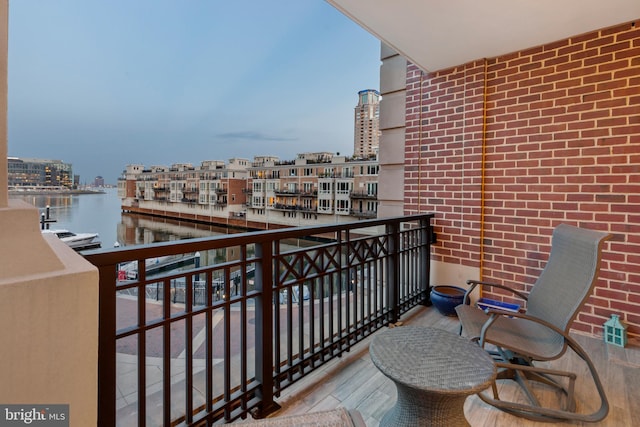 balcony featuring a water view