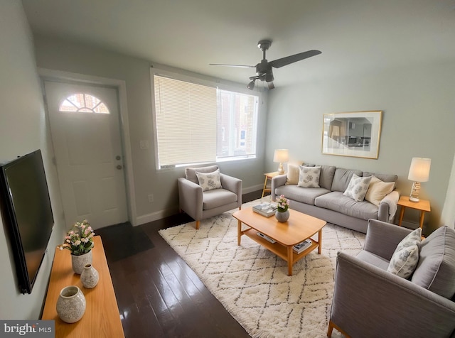 living room with ceiling fan, baseboards, and hardwood / wood-style floors