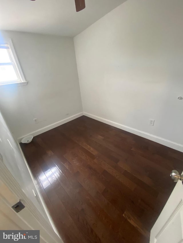 empty room featuring ceiling fan and hardwood / wood-style flooring