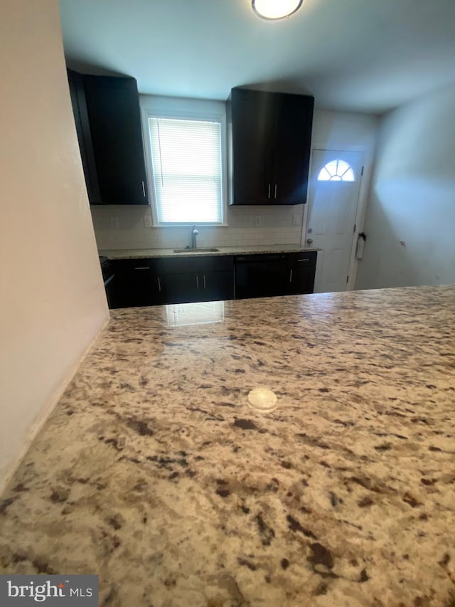 kitchen with tasteful backsplash and sink