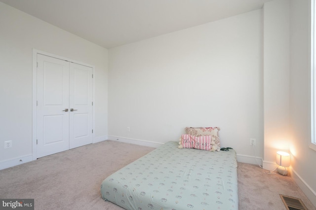 bedroom with light carpet