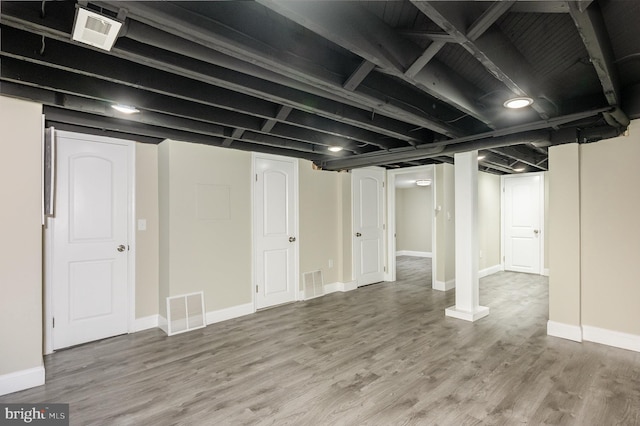 basement with wood-type flooring