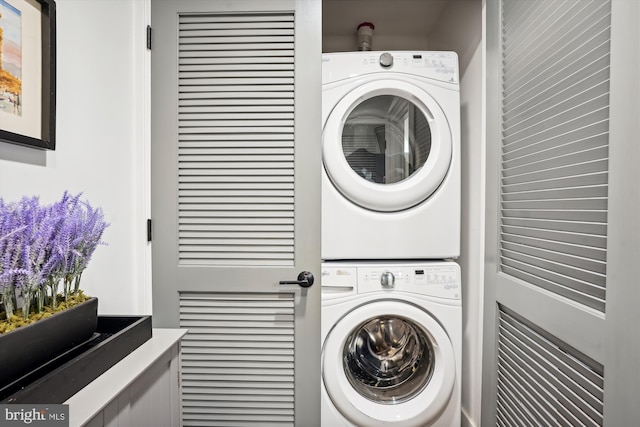 laundry area featuring stacked washing maching and dryer