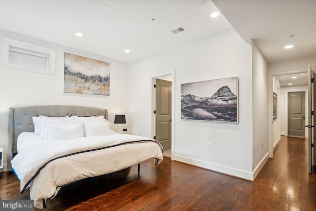 bedroom featuring dark hardwood / wood-style flooring