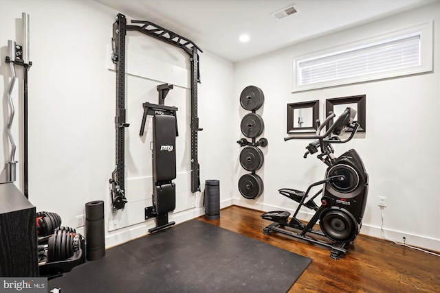 workout room with hardwood / wood-style floors