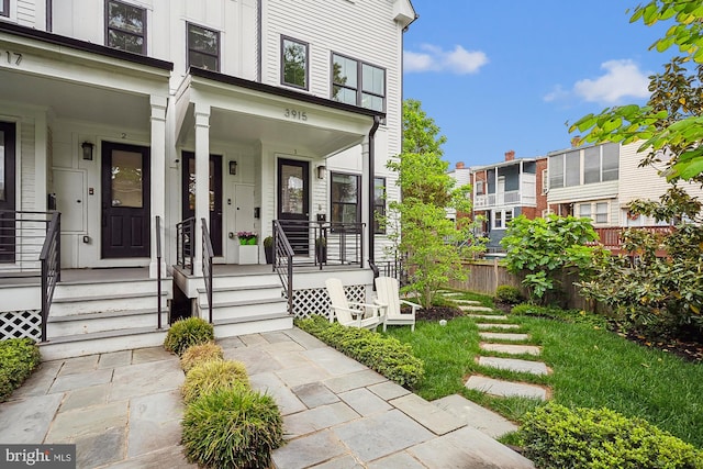 entrance to property featuring covered porch