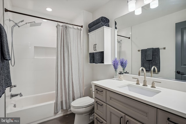 full bathroom featuring vanity, toilet, shower / tub combo with curtain, and tile patterned floors