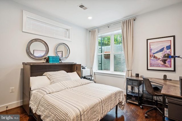 bedroom featuring dark hardwood / wood-style flooring