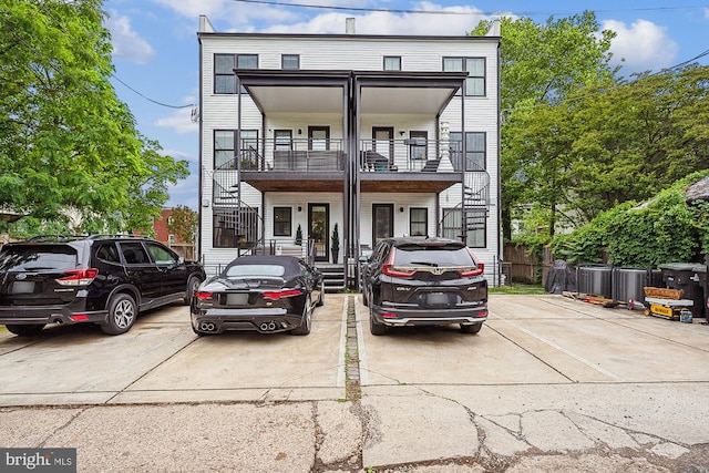 view of front of property with a balcony