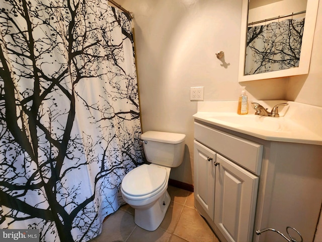 bathroom with vanity, toilet, a shower with shower curtain, and tile patterned floors