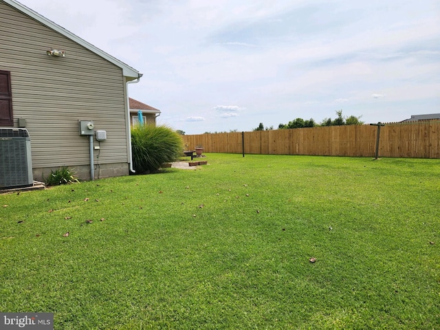 view of yard with central air condition unit