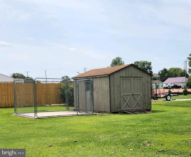 view of outbuilding with a lawn