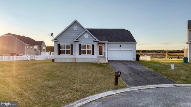 view of front of home with a garage, aphalt driveway, a front lawn, and fence