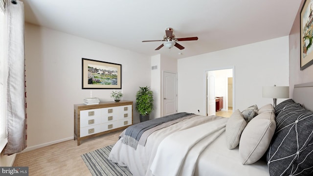 bedroom featuring ceiling fan, connected bathroom, light carpet, visible vents, and baseboards