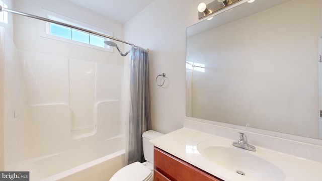 full bath featuring toilet, shower / bath combination with curtain, and vanity