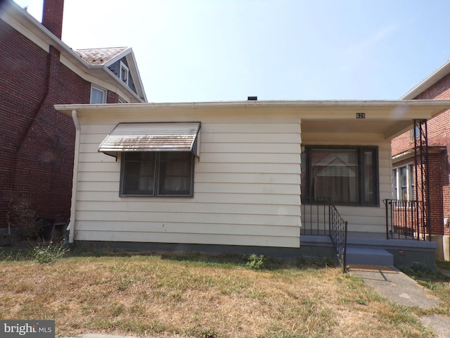 view of side of home featuring a lawn