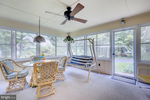 sunroom / solarium with ceiling fan