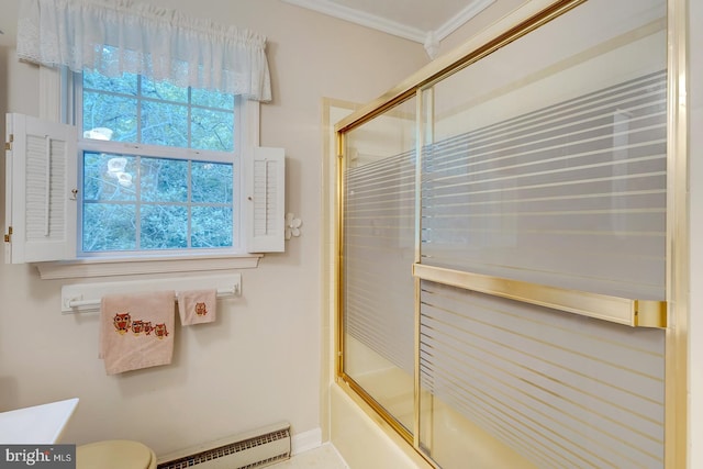 full bathroom with shower / bath combination with glass door, baseboard heating, ornamental molding, vanity, and toilet