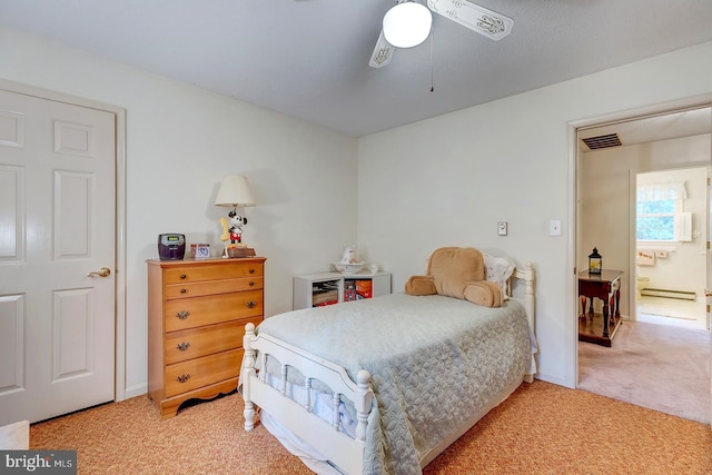 bedroom with carpet, a baseboard heating unit, and ceiling fan