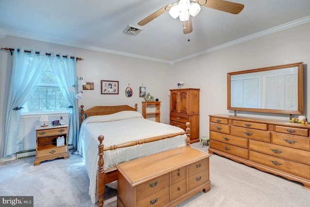 carpeted bedroom with ornamental molding, a baseboard heating unit, ceiling fan, and a textured ceiling