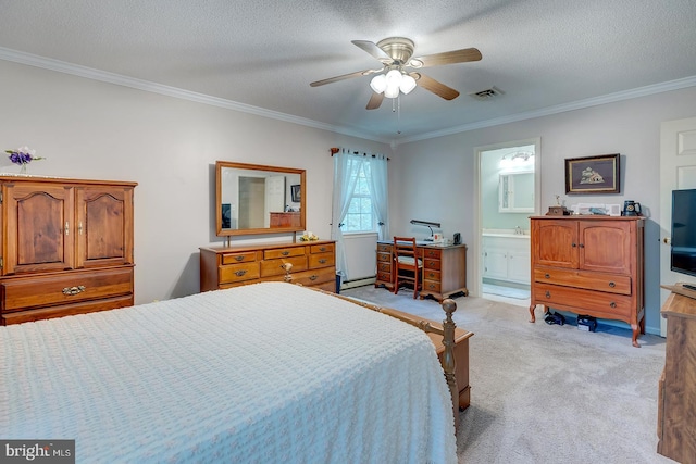 bedroom with a textured ceiling, light colored carpet, ensuite bathroom, crown molding, and ceiling fan