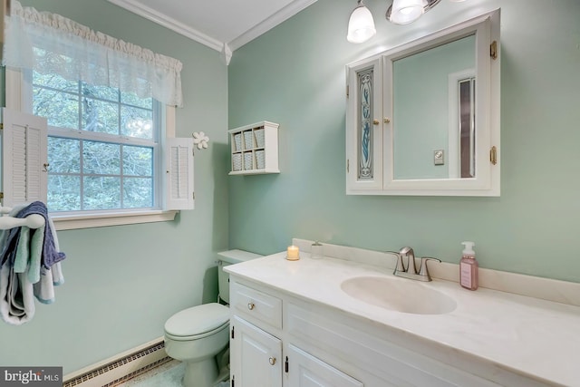 bathroom with ornamental molding, baseboard heating, vanity, and toilet