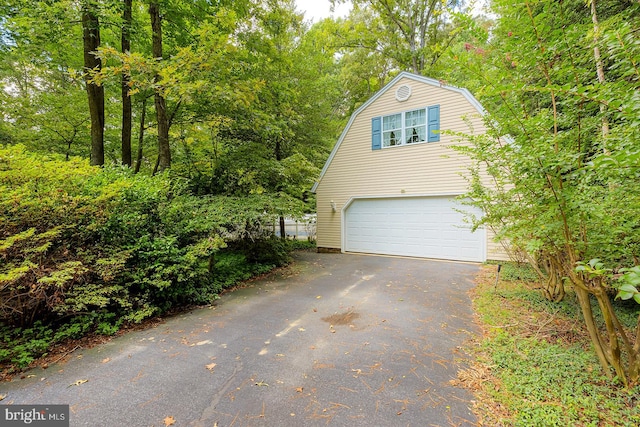 view of side of home with a garage