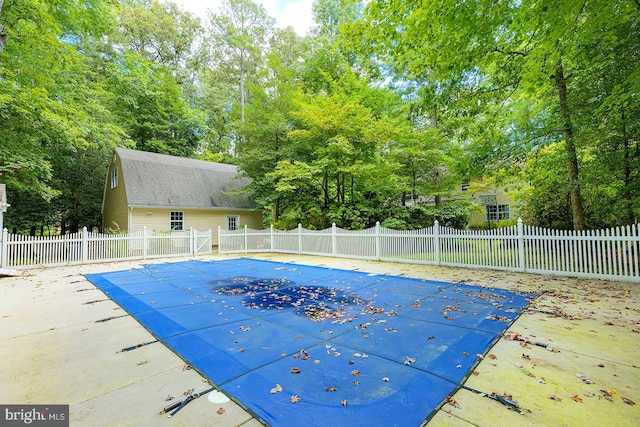 view of swimming pool with a patio