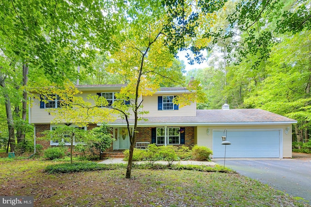 front of property with a garage and covered porch