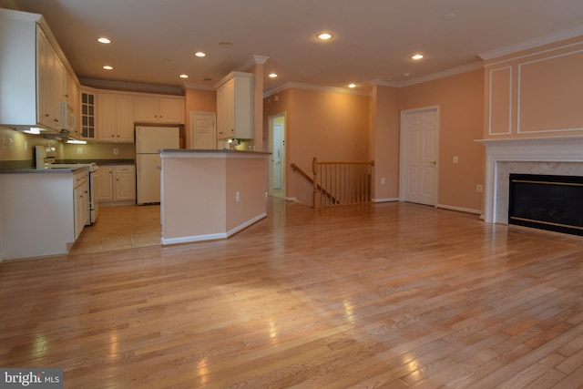 kitchen featuring light wood-type flooring, a fireplace, white appliances, crown molding, and white cabinets