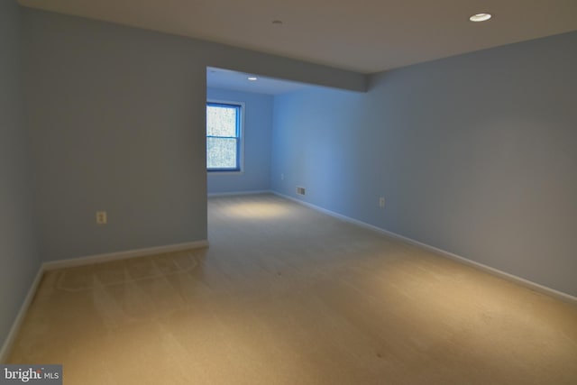 spare room with light carpet