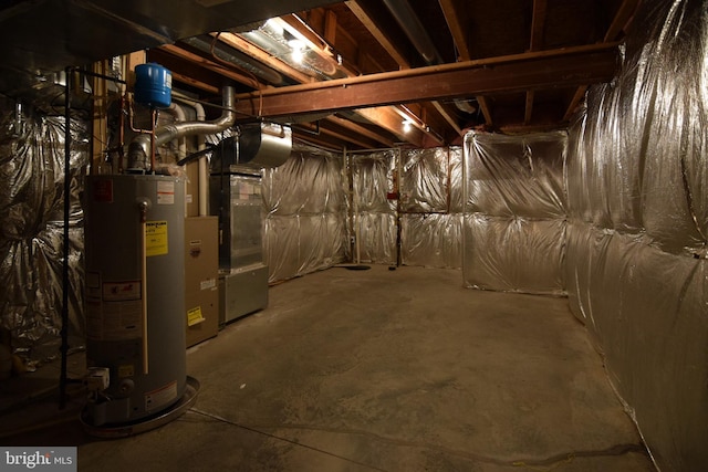 basement featuring gas water heater and heating unit