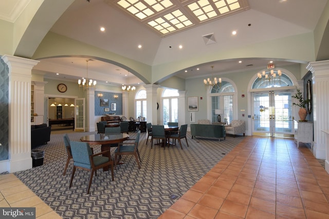 dining area with tile patterned floors, plenty of natural light, and french doors