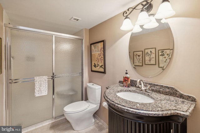 bathroom featuring vanity, toilet, and a shower with door